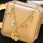 Collier Étoile Hippocampe Coquillage Doré Acier